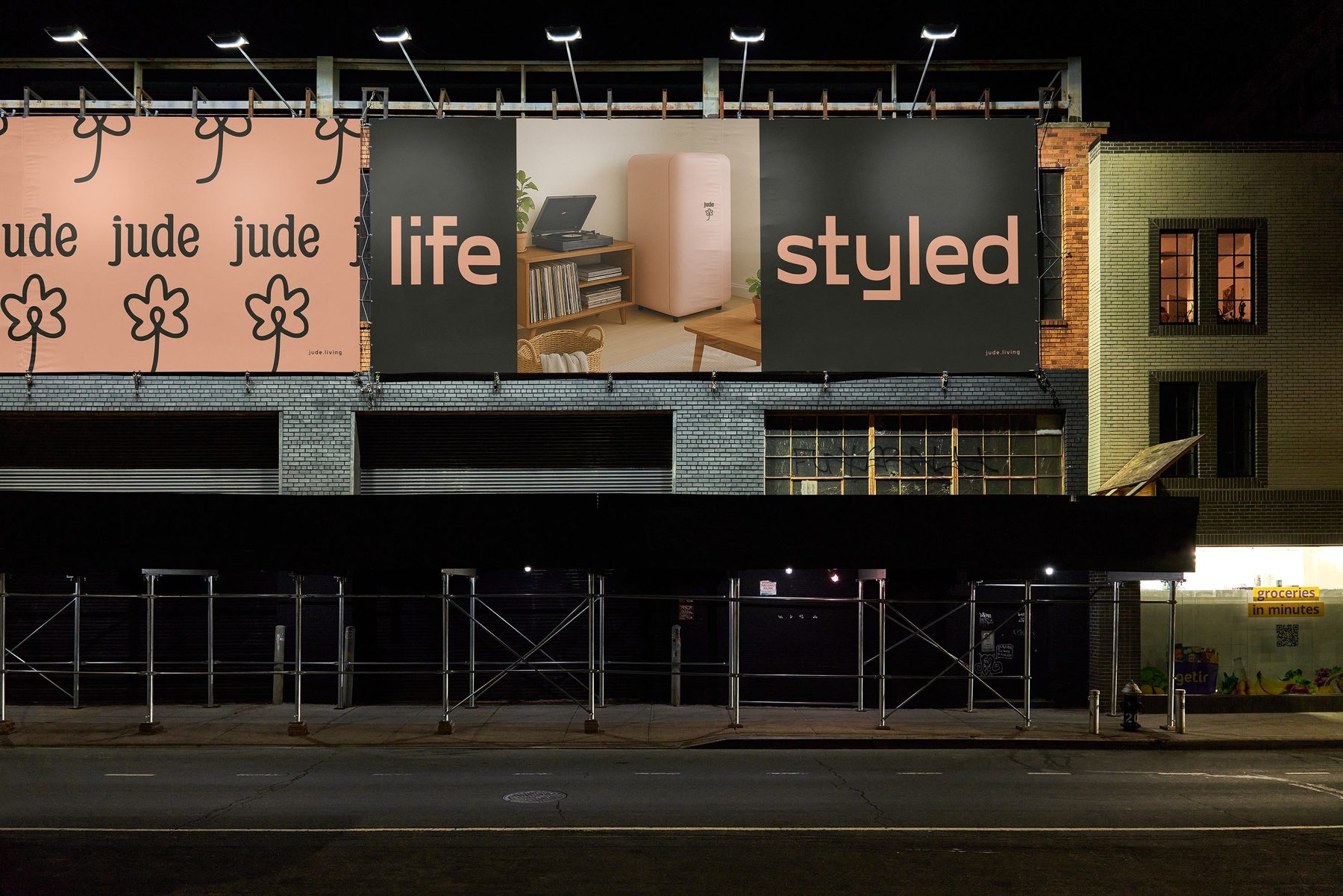 jude billboard at night in New York — life styled