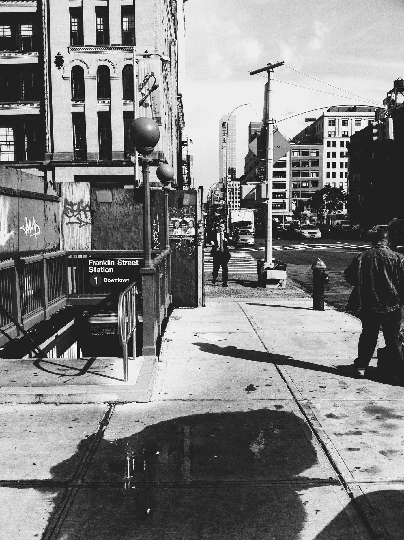 black and white street scene at Franklin Street Station, NYC
